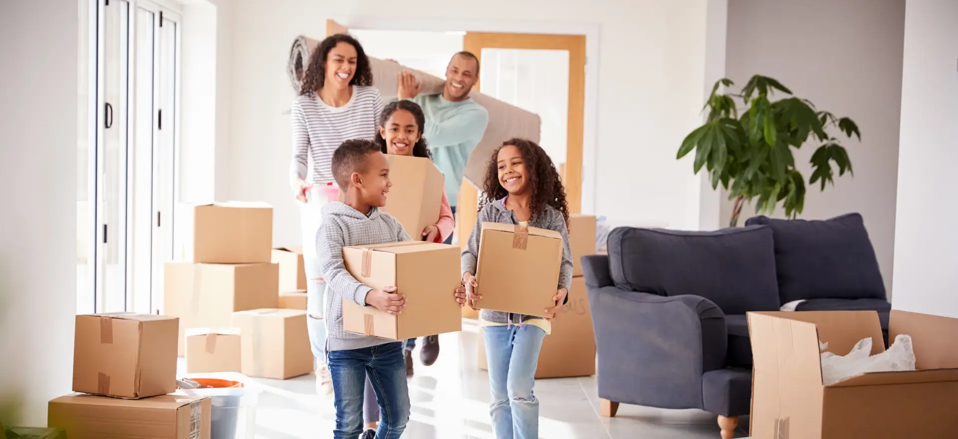 Happy family moving in to their new home thanks to First United Funding